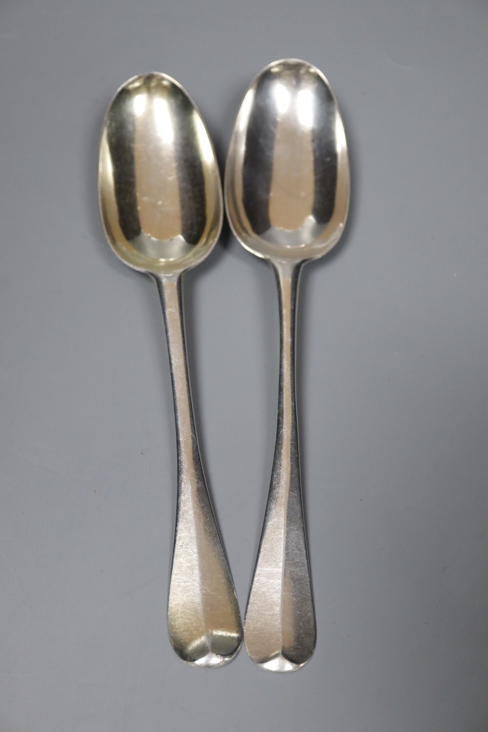 Two early 18th century silver Hanovarian rat tail pattern table spoons,